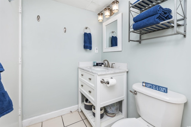 bathroom with vanity, toilet, and tile patterned flooring