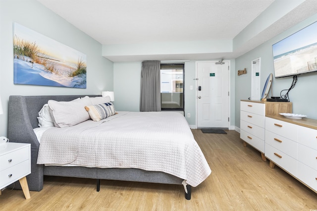 bedroom featuring light wood-type flooring