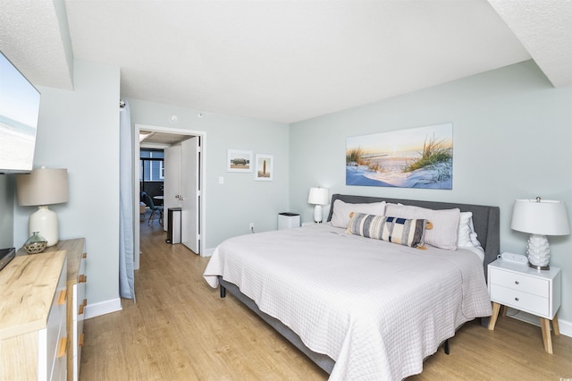 bedroom with light hardwood / wood-style floors