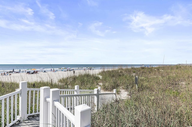 property view of water featuring a beach view