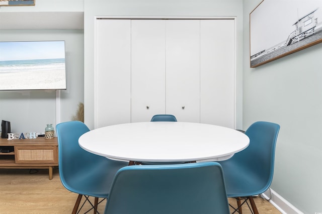 dining space featuring light wood-type flooring