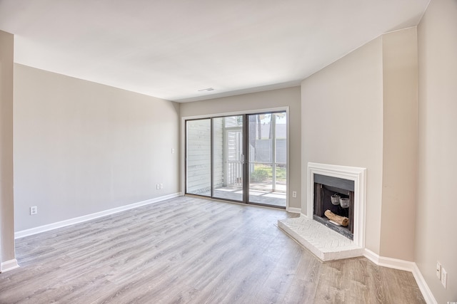 unfurnished living room featuring light wood-type flooring