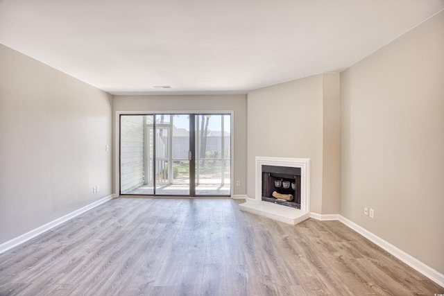 unfurnished living room with light hardwood / wood-style floors