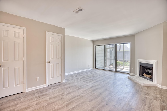 unfurnished living room featuring light wood-type flooring