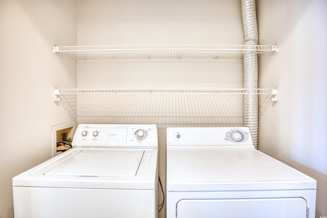 laundry room with separate washer and dryer