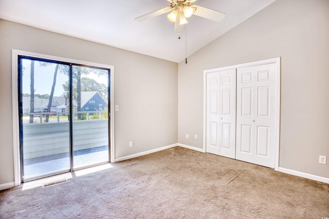 unfurnished bedroom featuring carpet flooring, ceiling fan, access to exterior, and a closet