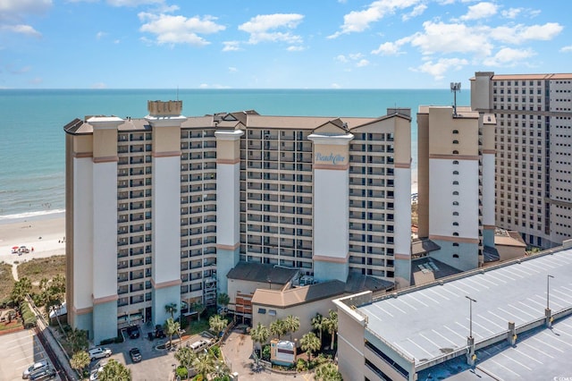 bird's eye view featuring a water view and a view of the beach