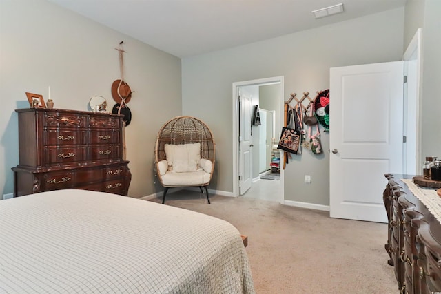 bedroom featuring light carpet