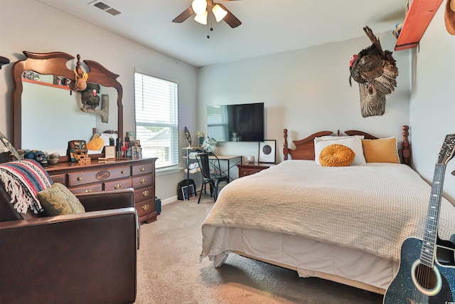 carpeted bedroom with ceiling fan