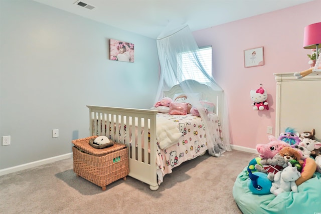 bedroom featuring light carpet