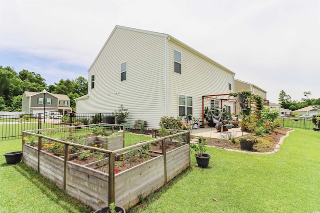 rear view of property featuring a patio, a lawn, and a pergola