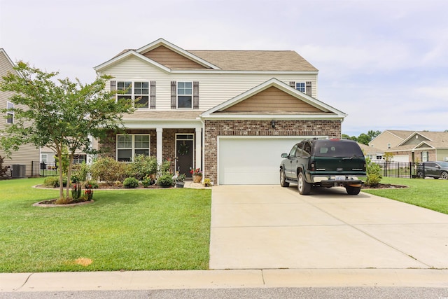 craftsman inspired home with a garage, a front yard, and central AC unit