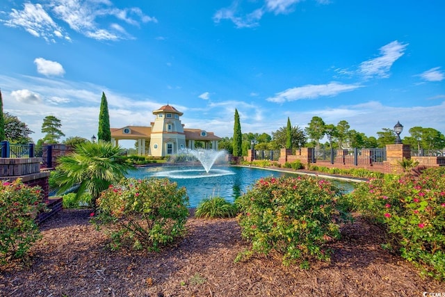 view of pool featuring a water view