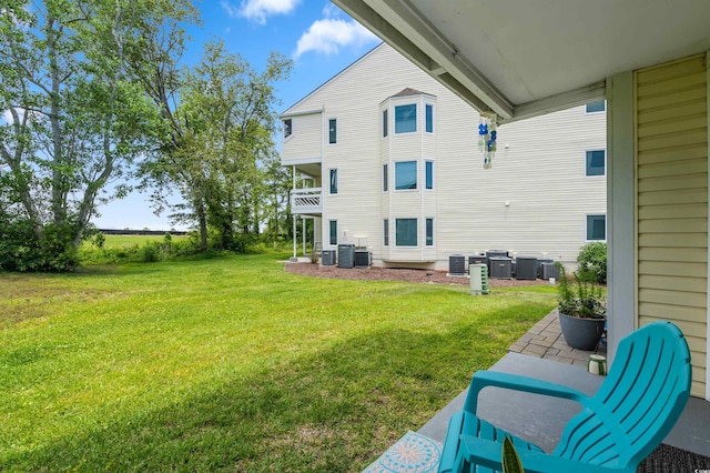 back of property featuring a yard and cooling unit