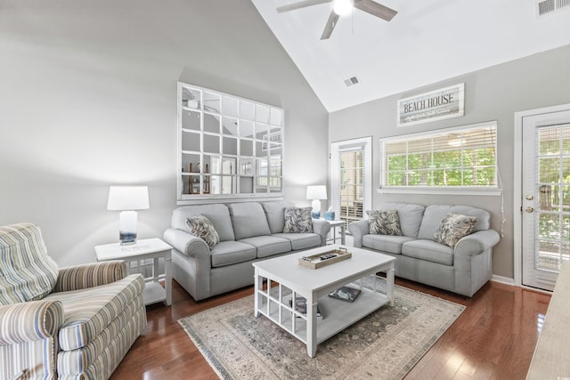 living room featuring ceiling fan, dark hardwood / wood-style floors, and high vaulted ceiling