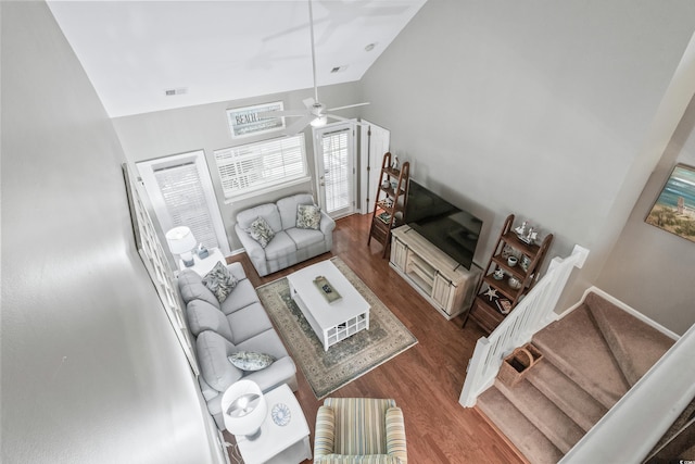 living room with hardwood / wood-style flooring, lofted ceiling, and ceiling fan