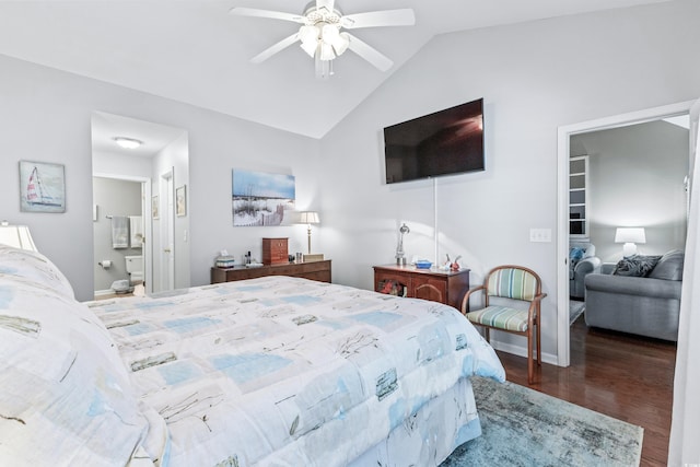 bedroom with dark wood-type flooring, ceiling fan, vaulted ceiling, and ensuite bath