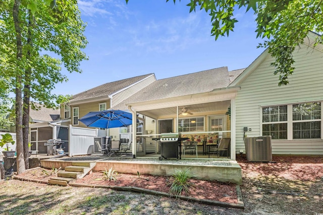 rear view of house featuring a patio, a sunroom, cooling unit, and ceiling fan