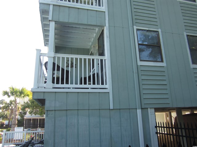 view of home's exterior with a balcony