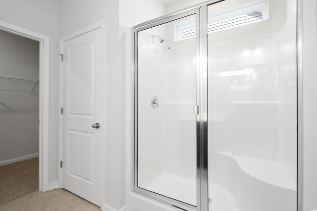 bathroom featuring an enclosed shower