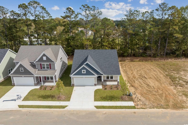 view of front of house with a garage and a front lawn