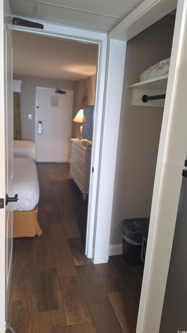 hallway featuring dark hardwood / wood-style flooring