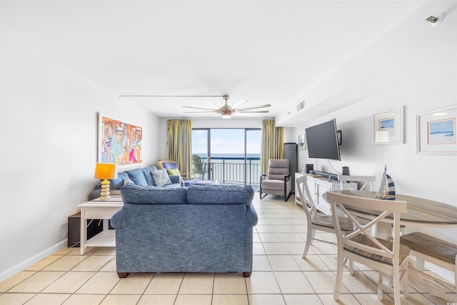 tiled living room with ceiling fan