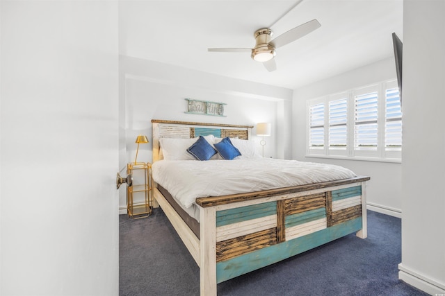 bedroom featuring ceiling fan and dark carpet