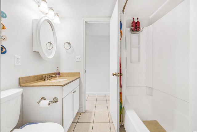 full bathroom featuring tile patterned floors, vanity, toilet, and  shower combination