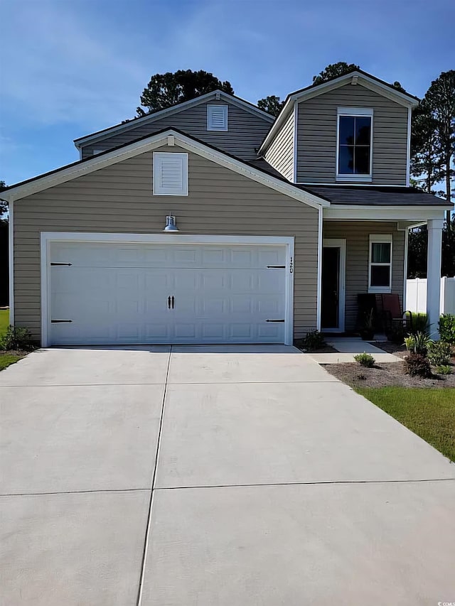 view of front of property with a garage and a porch