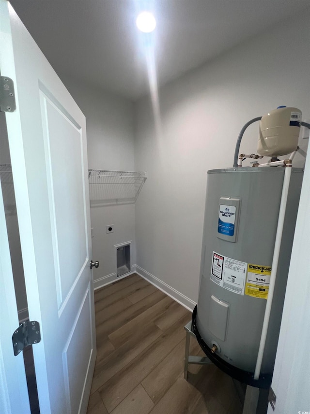 utility room featuring electric water heater