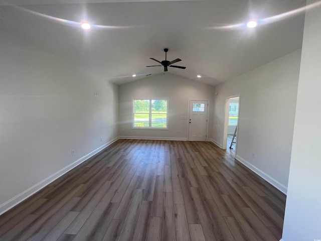 spare room with ceiling fan, dark hardwood / wood-style floors, and lofted ceiling