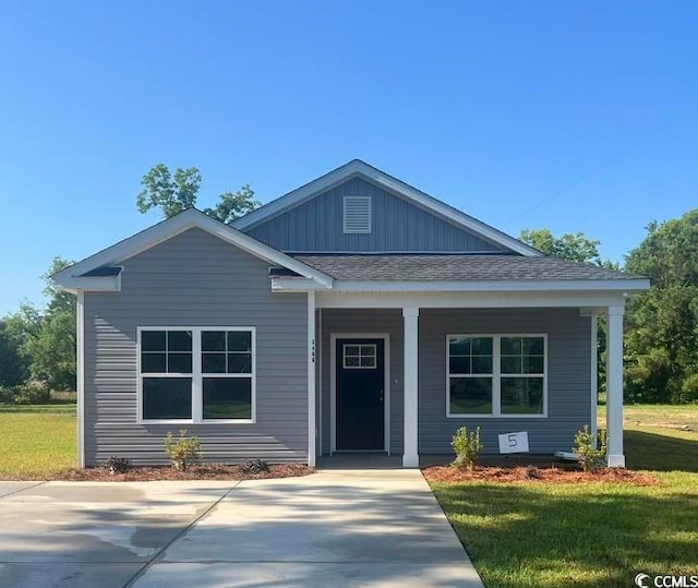 view of front of home featuring a front lawn and a porch