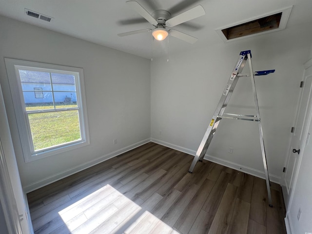 unfurnished bedroom with ceiling fan and dark hardwood / wood-style floors