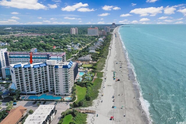 birds eye view of property featuring a view of the beach and a water view