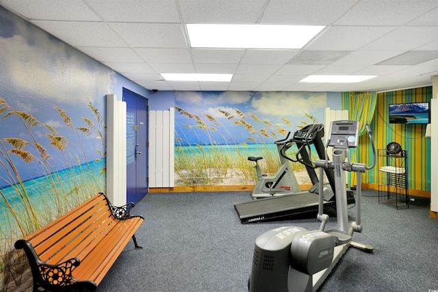 exercise room featuring wallpapered walls, baseboards, and a drop ceiling