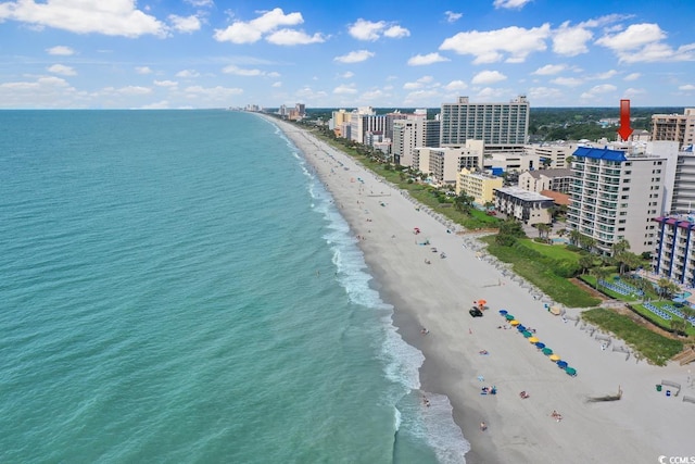 drone / aerial view with a view of the beach, a water view, and a view of city