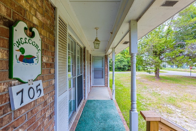 view of patio / terrace featuring visible vents and a porch