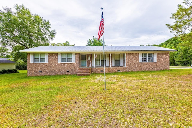 single story home with a front lawn, metal roof, brick siding, and crawl space