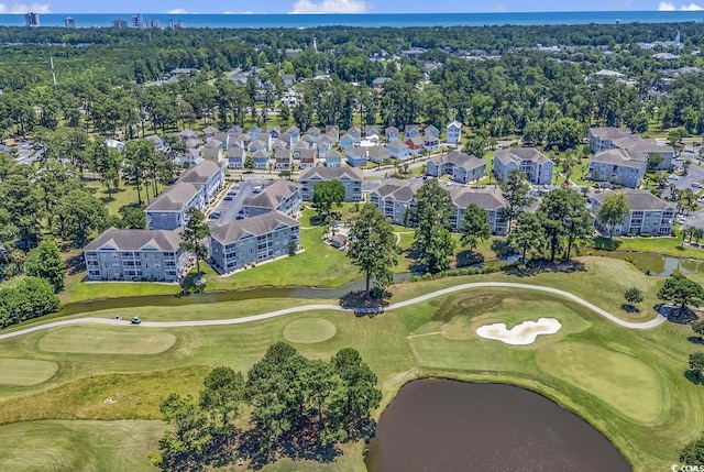 bird's eye view with golf course view, a water view, and a residential view