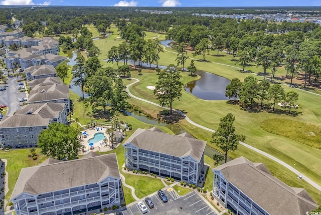 aerial view with view of golf course and a water view