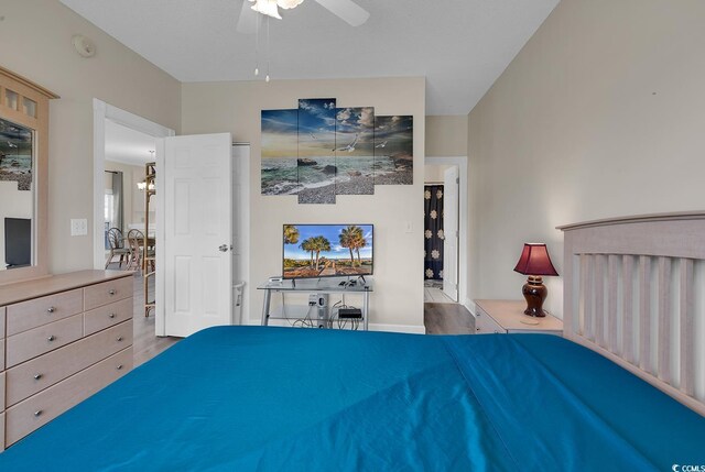 bedroom with light wood-type flooring and ceiling fan