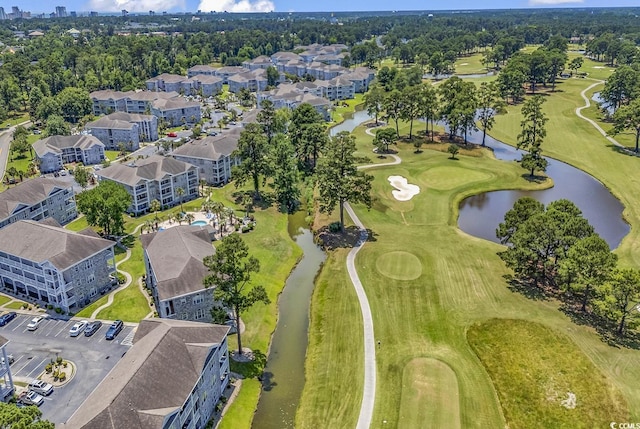 birds eye view of property with a residential view, view of golf course, and a water view