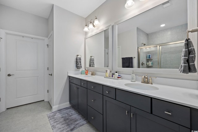 bathroom featuring vanity, tile patterned floors, and an enclosed shower