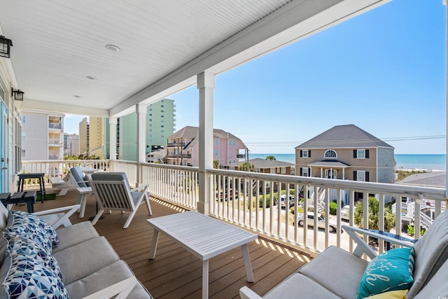 wooden deck with a water view