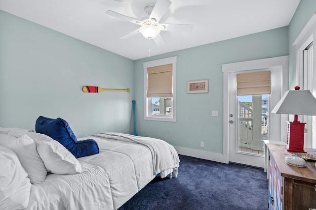 bedroom featuring dark carpet and ceiling fan