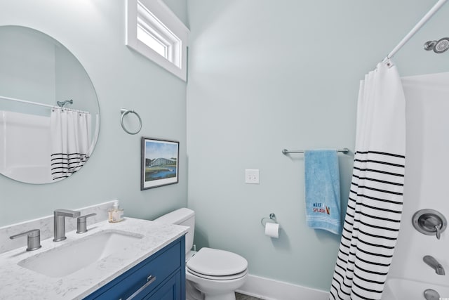 full bathroom featuring vanity, shower / tub combo, and toilet