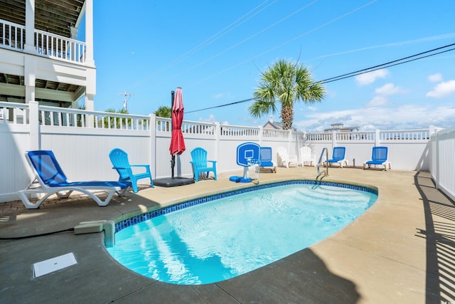 view of pool featuring a patio area