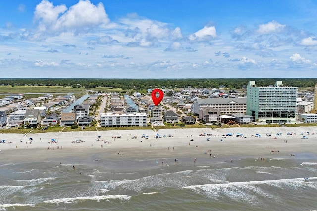 aerial view featuring a view of the beach and a water view