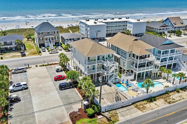 aerial view featuring a water view and a beach view